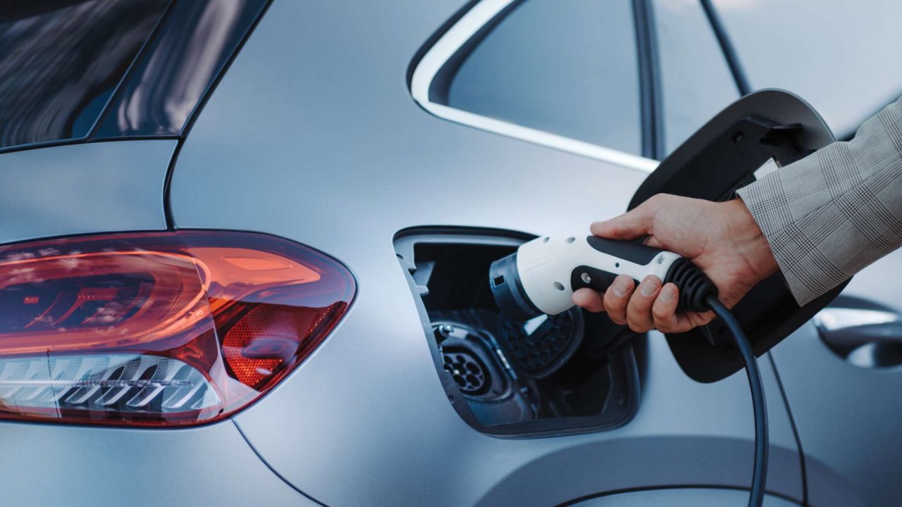 Image of someone charging a car battery